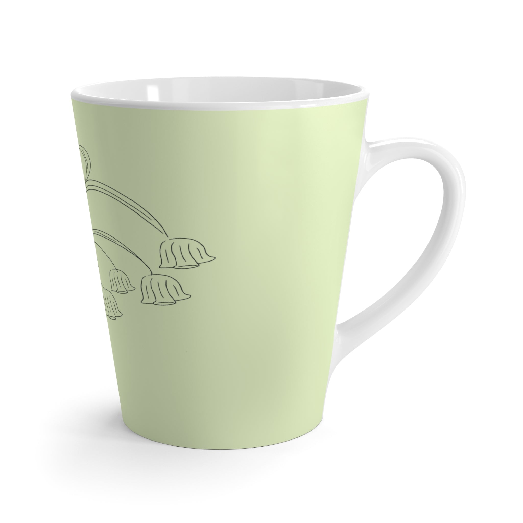 Tasse à café verte avec dessin de fleurs