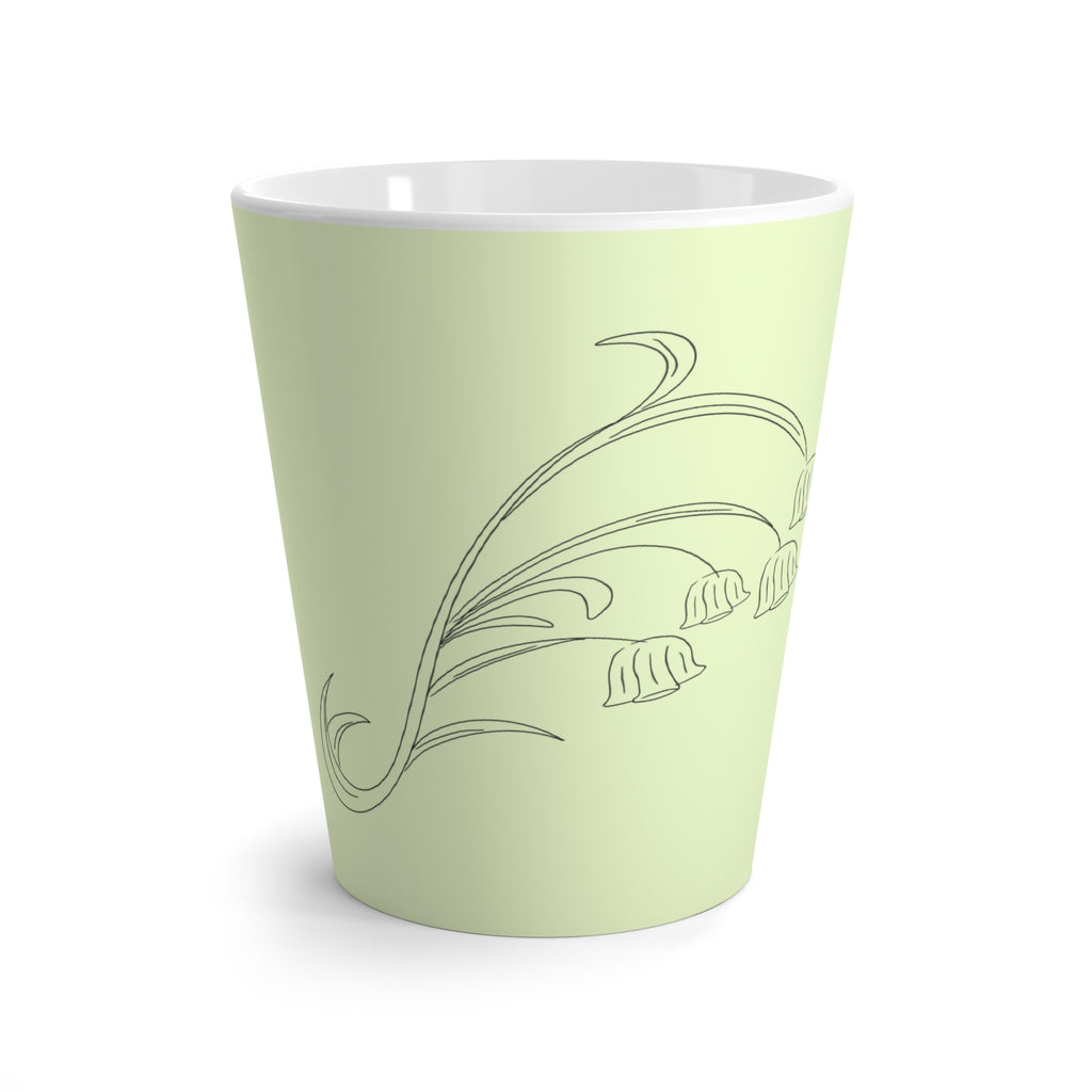Tasse à café verte avec dessin de fleurs